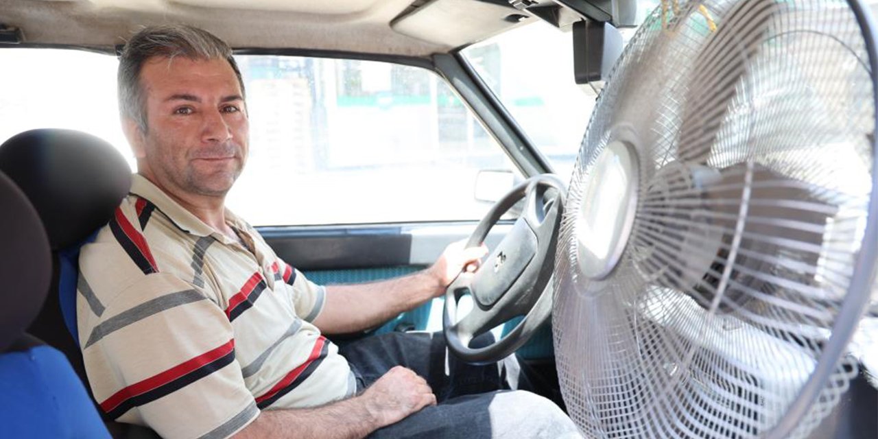 Sıcaktan bunalan sürücü otomobiline vantilatör taktı