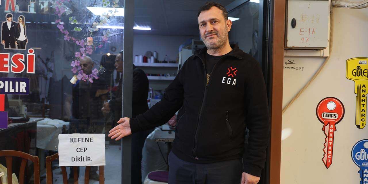 İş yerinin camına ‘Kefene cep dikilir’ yazdı