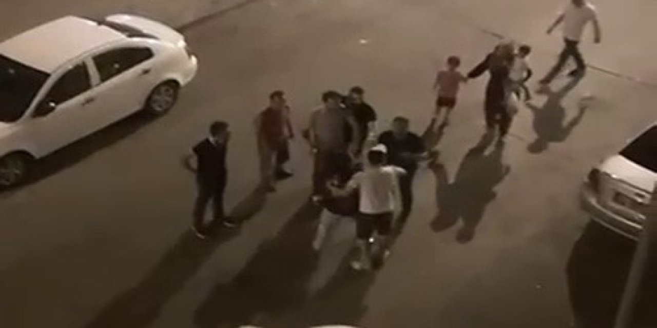 Karısına şiddet uyguladığı için dayak yiyecekti, onun arkasına saklandı