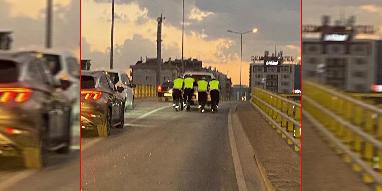 Konya’da aracı üst geçitte arıza yapan sürücünün yardımına trafik polisi koştu