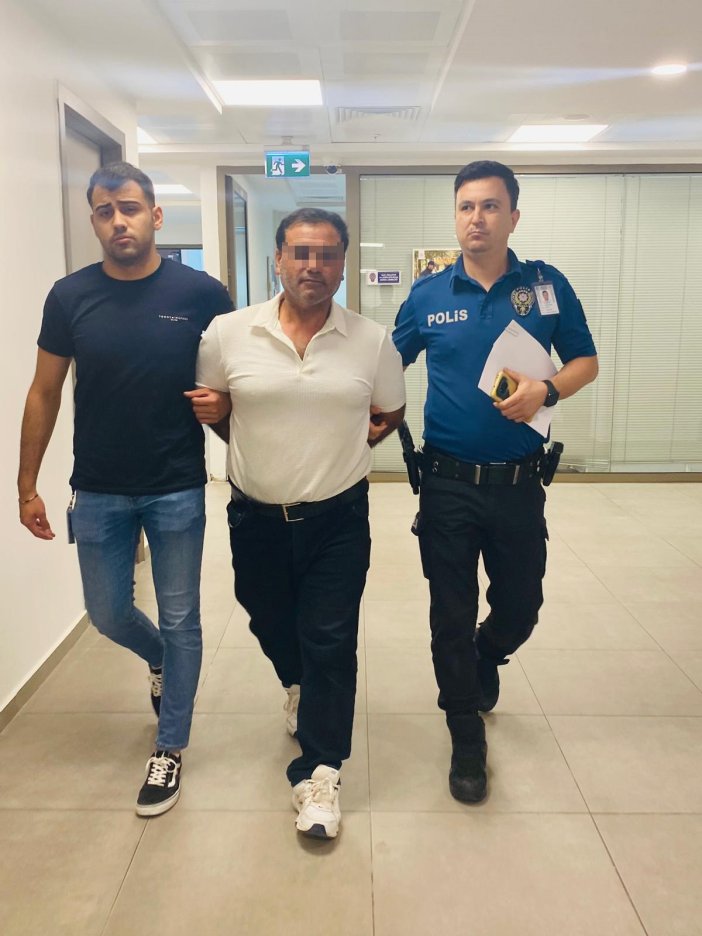 kirmizi-bultenle-aranan-hukumlu-havalimaninda-yakalandi.jpg